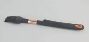 Silicone kitchen basting brush with rose gold accent, non-stick cooking and baking tool.
