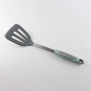 Detailed view of the kitchen silicone slotted spatula with stainless steel handle and hanging hole.