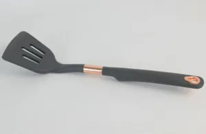 Silicone slotted spatula with rose gold accent, durable kitchen cooking tool detail view.
