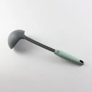 Silicone soup ladle with stainless steel handle, ideal for cooking and non-stick cookware.