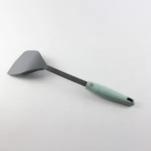 Detailed view of silicone kitchen spatula handle, ergonomic grip for non-stick cookware use.