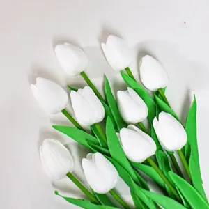 Artificial white tulip bouquet detail view floral arrangement photography props.