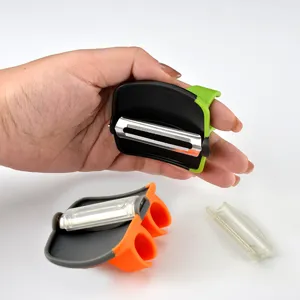 Éplucheur de légumes de doigt innovant avec lame en acier inoxydable et poignée ergonomique.