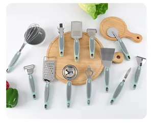 Stainless steel kitchen tools set 12 pieces, versatile cooking gadgets with green handles.