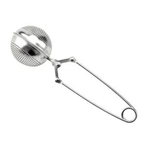 Stainless steel tea infuser ball with squeeze handle for loose leaf tea brewing easily.