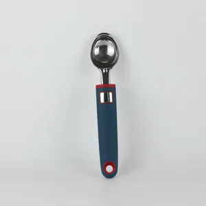 Stainless steel ice cream scoop kitchen gadget with ergonomic handle for baking and cooking detail view.