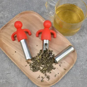 Portable silicone human shaped tea infuser with stainless steel mesh for loose leaf tea brewing.