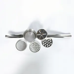 Stainless steel potato ricer detail showing interchangeable disks and press mechanism.