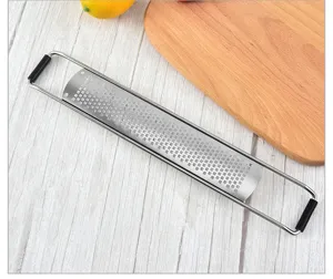 Stainless steel long kitchen grater with black handles for cheese, lemon zesting and food prep.