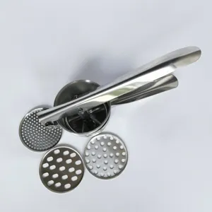 Stainless steel potato ricer detail view with interchangeable mesh discs for kitchen food prep.