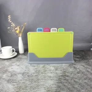 Plastic classification cutting board 4-piece set with holder for kitchen and baby use.