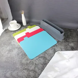 Plastic cutting board set with 4 color-coded boards and storage holder for kitchen use.