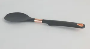 Silicone kitchen cooking spoon detail view, black spatula with rose gold accent, safe.