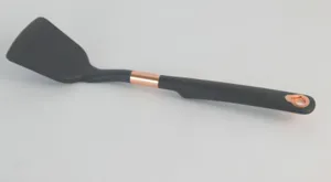 Black silicone kitchen spatula detail shot with stylish copper accent ring and convenient hanging hole.