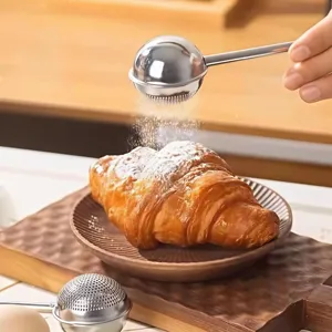 Stainless steel push tea infuser and flour sifter ball for kitchen baking main view.