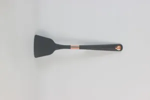 Silicone spatula kitchen utensil detail shot, dark grey finish with rose gold accent.
