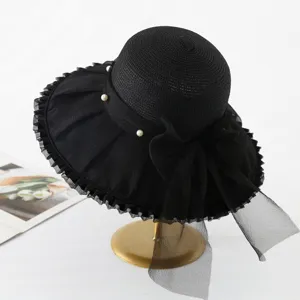 Elegant black organza sun hat with pearls and bow, wide brim for women summer beach vacation.