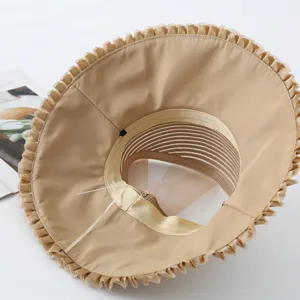 Detail view of women's wide brim organza sun hat, lightweight breathable beach vacation hat.