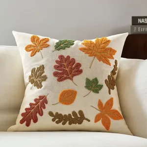 Autumn maple leaf embroidered throw pillow detail, textured fall cushion cover for home decor.
