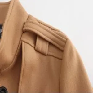Detailed view of men camel wool blend coat shoulder epaulet and collar winter outerwear.