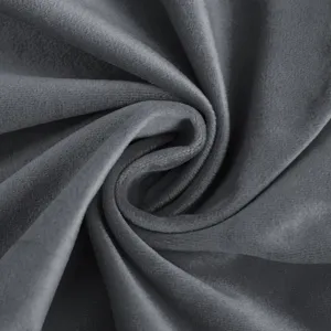 Dark gray velvet fabric texture close up view soft touch smooth surface home decor detail