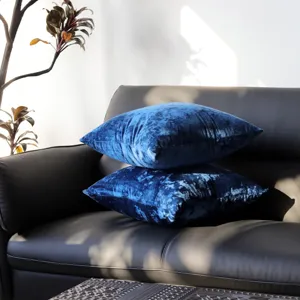 Luxury crushed velvet throw pillow covers in deep blue, soft cushion case for sofa decor.
