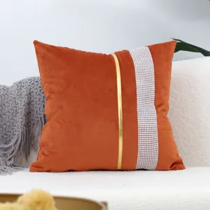 Orange velvet throw pillow cover with gold stripe and rhinestone trim for modern sofa decor