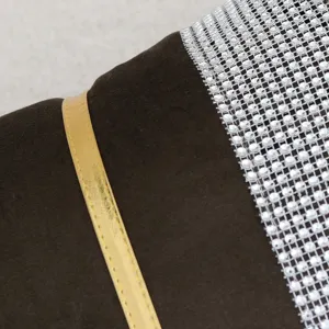 Velvet cushion cover detail showing rhinestone mesh and gold trim for luxury home decor style.