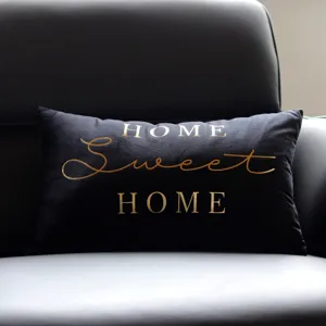 Black velvet lumbar throw pillow cover featuring elegant gold foil typography text design.