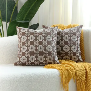 Jacquard throw pillow cover detail, brown and white floral pattern, modern home decor sofa cushion.