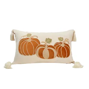Autumn pumpkin embroidered throw pillow cover with tassels for home fall holiday decor.