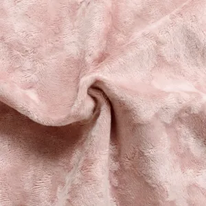 Close-up fabric texture detail of soft pink velvet cushion cover with luxurious plush pile.