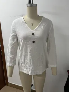 Detailed view of white cotton linen v-neck button three quarter sleeve top for women.