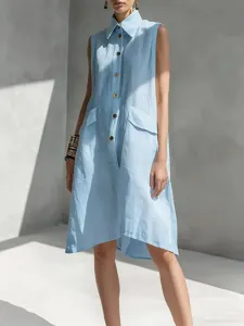Detail shot of a casual sleeveless cotton shirt dress featuring a classic collar and front buttons.