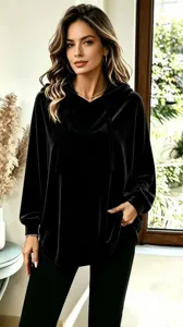 Detailed view of the elegant black velvet hooded shirt showing soft fabric and fit.