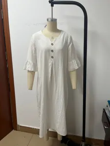 Casual white linen V-neck dress with ruffles and large buttons for comfortable daily summer wear.