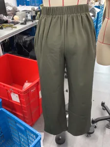 Detail view of army green wide leg pants, casual high waist elastic design, loose fit fabric