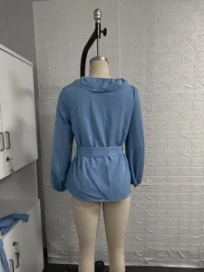 Blue long sleeve blouse V-neck ruffle collar waist belt back view detail apparel top