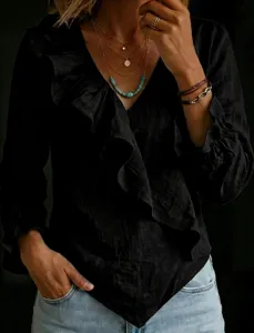 Detailed view of the black linen shirt showing V-neck and stylish ruffle details.