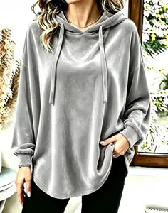 Close-up detail of the soft grey velvet hoodie, featuring comfortable long sleeves.