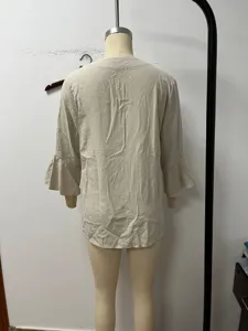 Detailed back view of casual linen bell sleeve women shirt, loose fit solid beige top view.