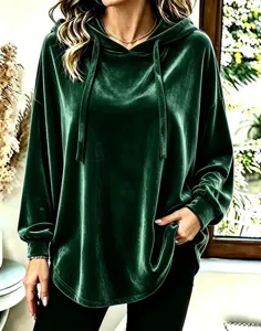 Dark green velvet long sleeve hoodie featuring a cozy drawstring and relaxed fit design.