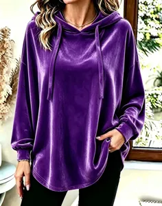 Close-up detail of the soft purple velvet hoodie featuring a cozy drawstring and long sleeves.