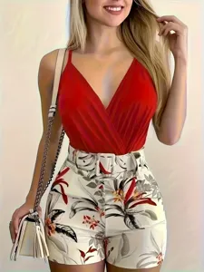 Stylish women red camisole top and botanical print shorts outfit detail showcase.