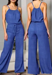 Textured spaghetti strap jumpsuit featuring a waist drawstring and draped wide-leg design.