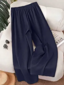 Casual wide-leg suit pants detail shot, showing smooth fabric texture and comfortable elastic waist.