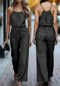 Women textured spaghetti strap jumpsuit with drawstring waist and wide leg casual pants.