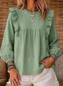 Close-up view of the sage green boho ruffle blouse featuring bubble sleeves and delicate details.