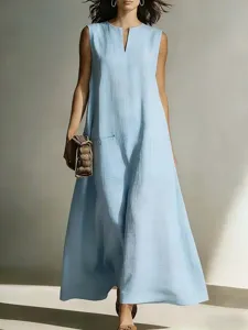 Close-up detail of the light blue sleeveless maxi dress showing V-neck and pocket style.
