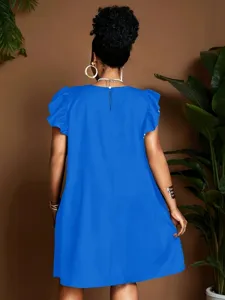 Back view detail of bright blue casual short sleeve dress with elegant ruffle cuffs.